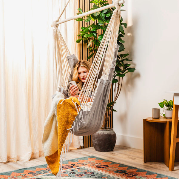 Grey hammock chair styled in a room