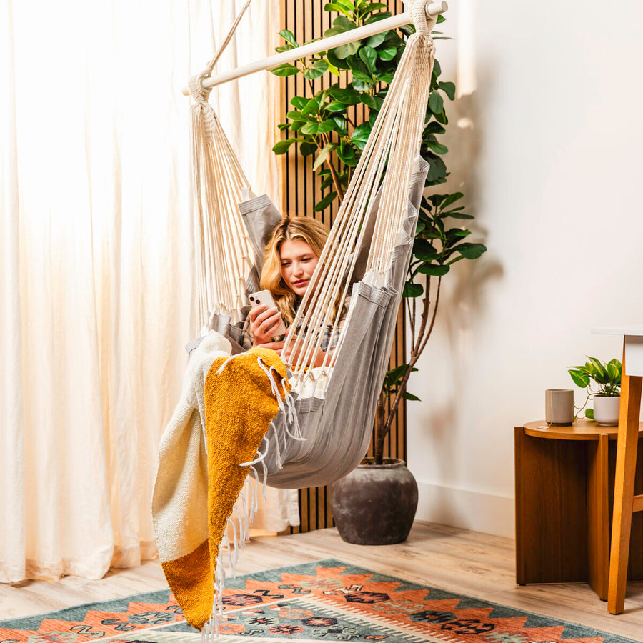 Grey hammock chair styled in a room