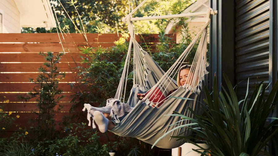 Stretched out fully in the hammock chair with the footrest extended