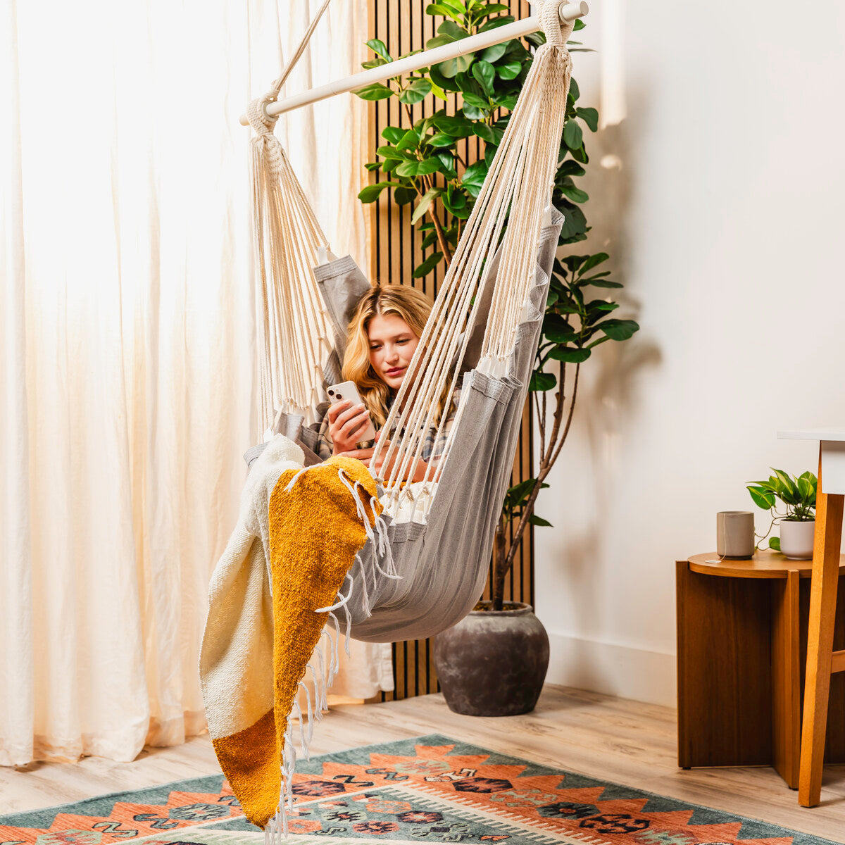 Grey hammock chair styled in a room