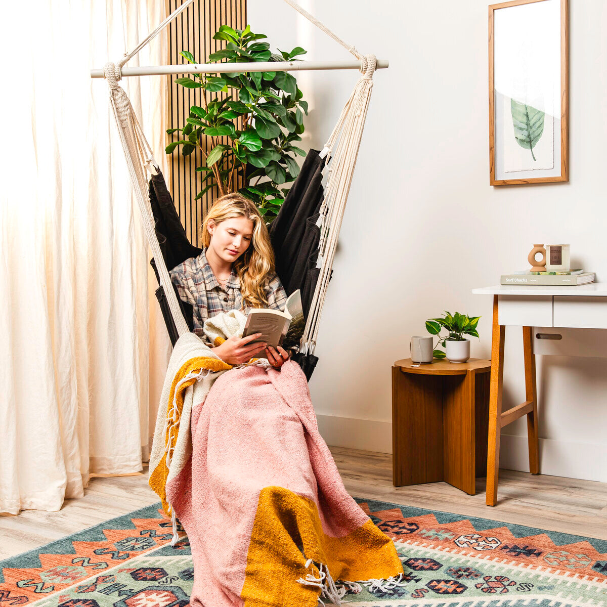 Black hammock chair styled in a room